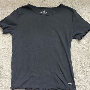 This is a deep navy blue color with a pretty cut on the sleeves and bottem